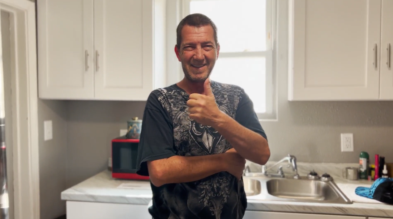 Client housed by Foundation for Pops through our Master Leasing Program Initiative giving a thumbs up
